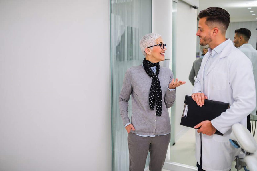 Dentist talking to a patient