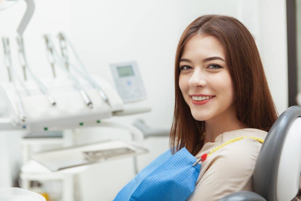 smiling woman in dental chair