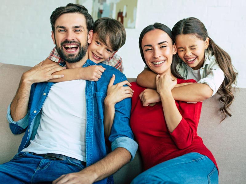 smiling family of four